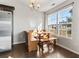 Bright dining area with a built-in bench, wooden table and a large window offering abundant natural light at 1801 Heirloom Dr., Conway, SC 29527