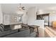 Inviting living room featuring hardwood floors and a view into the kitchen with stainless steel appliances at 1801 Heirloom Dr., Conway, SC 29527