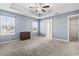 Serene main bedroom with tray ceiling, carpet floors, and windows offering natural light and calm feel at 1801 Heirloom Dr., Conway, SC 29527