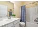 Bathroom featuring a shower with bathtub, toilet, sink, mirror, and a towel rack at 182 Minnow Dr., Pawleys Island, SC 29585