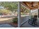 Inviting front porch with rocking chairs and a view of the landscaped front yard at 182 Minnow Dr., Pawleys Island, SC 29585