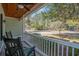 Inviting front porch with cozy rocking chairs, a wood ceiling, and a view of the neighborhood at 182 Minnow Dr., Pawleys Island, SC 29585