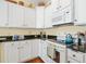 Well-equipped kitchen featuring ample counter space, a white oven, and modern appliances at 182 Minnow Dr., Pawleys Island, SC 29585