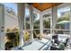 Relaxing screened porch with wood ceiling and outdoor views at 182 Minnow Dr., Pawleys Island, SC 29585