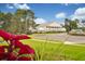 Stately clubhouse featuring a grand facade, manicured lawn, and ample parking at 1989 Wild Indigo Circle Nw # 9, Calabash, NC 28467