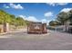 Elegant gated community entrance with brick pillars and manicured flower beds at 1989 Wild Indigo Circle Nw # 9, Calabash, NC 28467