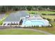 Aerial view of a large community pool area featuring ample seating and a surrounding landscape at 1989 Wild Indigo Circle Nw # 9, Calabash, NC 28467