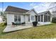 The back patio features an outdoor dining area with a grill, perfect for entertaining guests at 199 Glenwood Dr., Conway, SC 29526