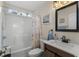 Bathroom with a shower-tub combination, wood-look sink, and a view of the window at 199 Glenwood Dr., Conway, SC 29526