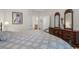 Bright bedroom featuring patterned bedding, a large dresser and views into the hallway at 199 Glenwood Dr., Conway, SC 29526