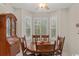 Charming dining area featuring a wooden hutch, bay window, and table with seating at 199 Glenwood Dr., Conway, SC 29526