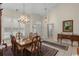 Formal dining room with a chandelier, rich wood furniture, and a view of the entryway at 199 Glenwood Dr., Conway, SC 29526