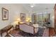 Cozy living room showcasing a comfortable seating arrangement and natural light from the screened porch at 199 Glenwood Dr., Conway, SC 29526