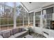 Bright sunroom with wall of windows overlooking the landscape at 199 Glenwood Dr., Conway, SC 29526