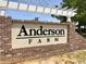 Community entrance sign featuring the development's name, Anderson Farm, with brick detail and mature trees at 2063 Nw Parow Ln Nw # E, Calabash, NC 28467