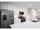 Modern kitchen featuring stainless steel appliances, white cabinetry, and a large quartz countertop at 2067 Nw Parow Ln Nw # C, Calabash, NC 28467