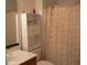 Bathroom showcasing a vanity, mirror, and patterned shower curtain at 207 Indian Wells Ct. # 207, Murrells Inlet, SC 29576