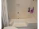 Clean and bright bathtub with tiled walls, soap dish, and fixtures at 207 Indian Wells Ct. # 207, Murrells Inlet, SC 29576