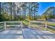 Back deck featuring a white railing and a view of a lush, green backyard at 221 Hagley Dr., Pawleys Island, SC 29585