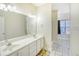 Bright bathroom featuring double sinks, tile flooring, and lots of counter space for storage at 221 Hagley Dr., Pawleys Island, SC 29585