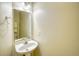 Bright bathroom with a pedestal sink and large mirror offering ample light at 221 Hagley Dr., Pawleys Island, SC 29585