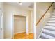 Hallway with hardwood floors, closet and access to the upper level at 221 Hagley Dr., Pawleys Island, SC 29585