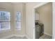 Well-lit laundry room featuring modern machines and additional storage space at 221 Hagley Dr., Pawleys Island, SC 29585