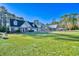 Expansive green lawn showcases this home with a brick exterior, dormer windows and separate garage on the property at 221 Hagley Dr., Pawleys Island, SC 29585