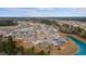 Aerial view showing the community's layout, pond views, and neatly arranged homes at 224 Pine Forest Dr., Conway, SC 29526