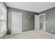 An empty bedroom with carpet, window with blinds, closet and green walls at 224 Pine Forest Dr., Conway, SC 29526