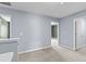 Upstairs bedroom with neutral carpet and walls features multiple doorways leading to other rooms at 224 Pine Forest Dr., Conway, SC 29526