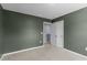 Bedroom with light carpet, green walls, closet and neutral trim at 224 Pine Forest Dr., Conway, SC 29526