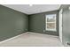 A carpeted bedroom featuring neutral walls and a window for ample natural light at 224 Pine Forest Dr., Conway, SC 29526