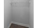 Empty closet features a single shelf for storage and wood-look flooring at 224 Pine Forest Dr., Conway, SC 29526