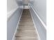 Carpeted staircase with white railing and neutral walls leading to the upper level at 224 Pine Forest Dr., Conway, SC 29526