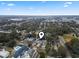 Aerial view of a quiet community with lush trees and landscaping, not far from the surrounding city and a baseball field at 300 Oak Lake Circle, North Myrtle Beach, SC 29582