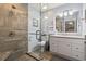 Updated bathroom with a glass-enclosed shower, modern fixtures, and a tiled floor at 300 Oak Lake Circle, North Myrtle Beach, SC 29582