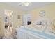 Charming bedroom with coastal decor, featuring a white bed frame and beach-themed bedding at 300 Oak Lake Circle, North Myrtle Beach, SC 29582