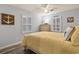 Bright bedroom with light blue walls, shuttered windows, and nautical decor at 300 Oak Lake Circle, North Myrtle Beach, SC 29582