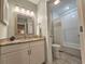 Well-lit bathroom featuring a granite countertop and a bathtub-shower combination enhancing functionality at 301 Myrtlewood Ct. # 17-E, Myrtle Beach, SC 29572