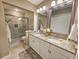 Beautiful bathroom featuring a double vanity, granite countertops, and a tiled glass shower at 301 Myrtlewood Ct. # 17-E, Myrtle Beach, SC 29572