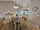 Cozy dining area with seating for six, an adjacent console table and partial view into kitchen at 301 Myrtlewood Ct. # 17-E, Myrtle Beach, SC 29572