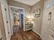 Hallway view with wood-look flooring, leading to the entryway and kitchen area at 301 Myrtlewood Ct. # 17-E, Myrtle Beach, SC 29572