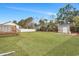 Large backyard featuring a deck, privacy fence, shed, and mature trees at 308 Stone Throw Dr., Murrells Inlet, SC 29576