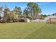 Expansive grassy backyard with storage shed and mature trees at 308 Stone Throw Dr., Murrells Inlet, SC 29576