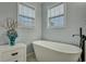 Bright bathroom featuring a standalone tub and modern decor at 308 Stone Throw Dr., Murrells Inlet, SC 29576