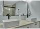 Contemporary bathroom boasts double sinks with modern faucets and a large mirror at 308 Stone Throw Dr., Murrells Inlet, SC 29576