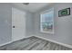 Cozy bedroom with natural light from a large window and neutral paint at 308 Stone Throw Dr., Murrells Inlet, SC 29576