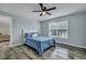 Calm bedroom with a ceiling fan, large window, and a cozy atmosphere at 308 Stone Throw Dr., Murrells Inlet, SC 29576