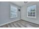 Bedroom with light blue walls and two windows offering natural light at 308 Stone Throw Dr., Murrells Inlet, SC 29576